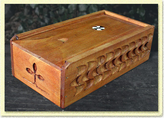 decorated wooden box with sliding lid